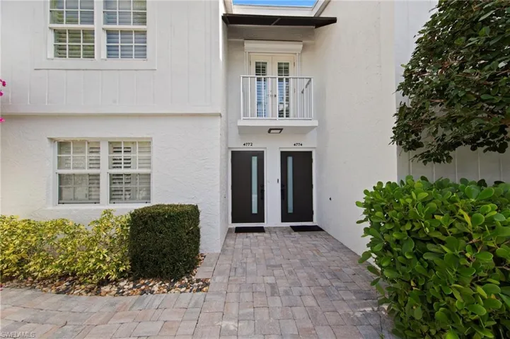 Doorway to property with stucco siding