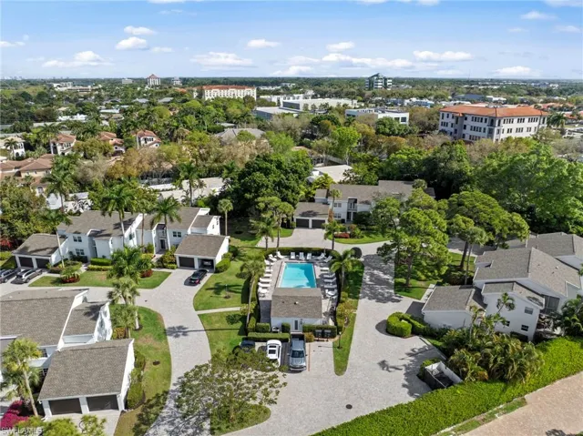 Aerial perspective of suburban area featuring a pool area