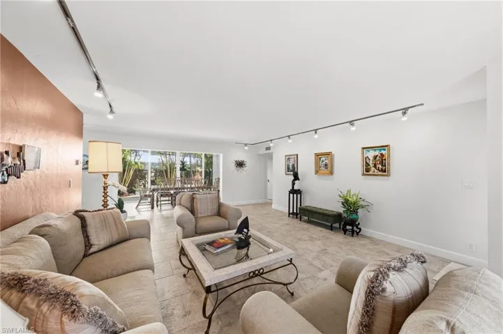 Living room featuring track lighting and baseboards