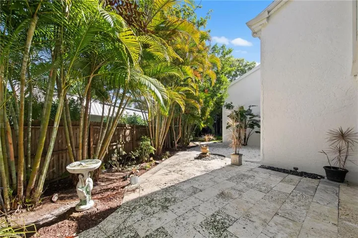 Fenced backyard with a patio area