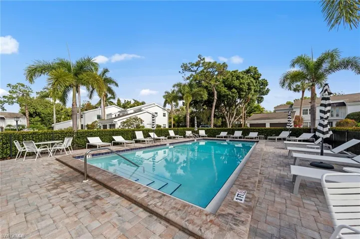 Community pool with a patio area