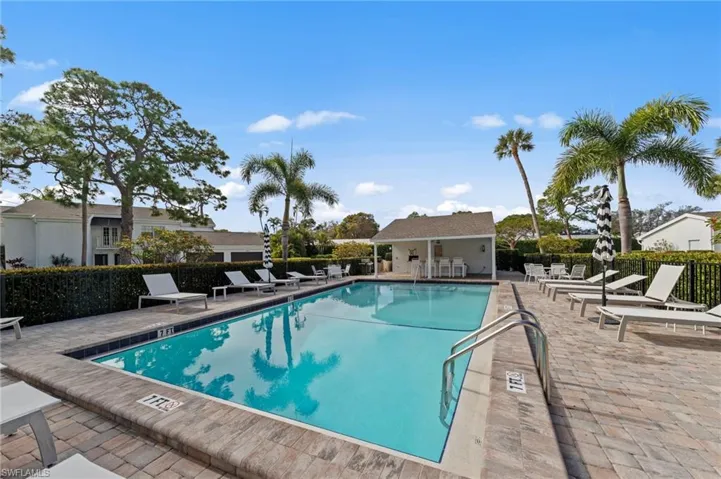Community pool featuring a patio