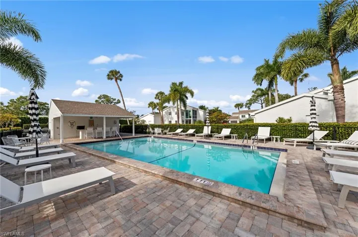 Community pool with a patio area