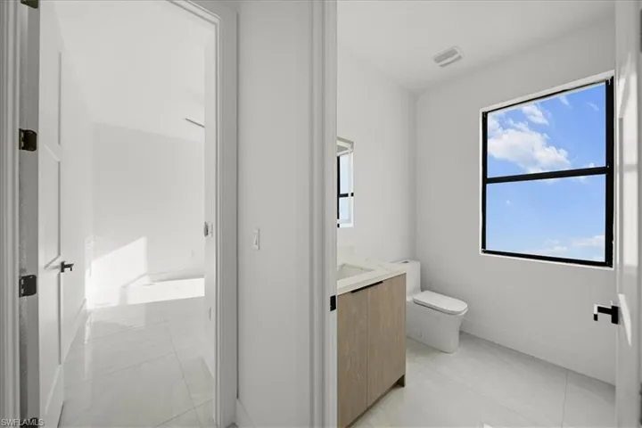 Bathroom featuring vanity and light tile patterned floors