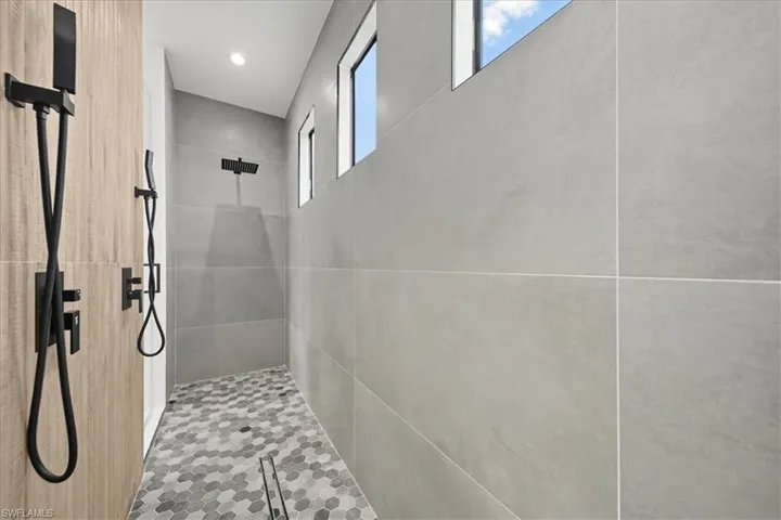 Bathroom featuring walk in shower and recessed lighting