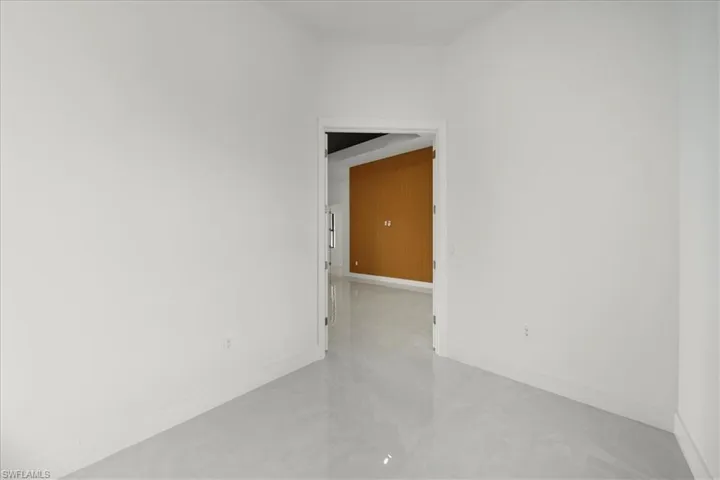 Unfurnished room with baseboards