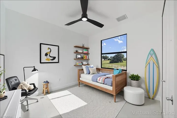 Bedroom featuring a ceiling fan and tile patterned flooring