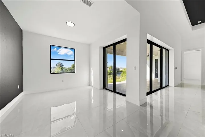 Unfurnished room featuring baseboards