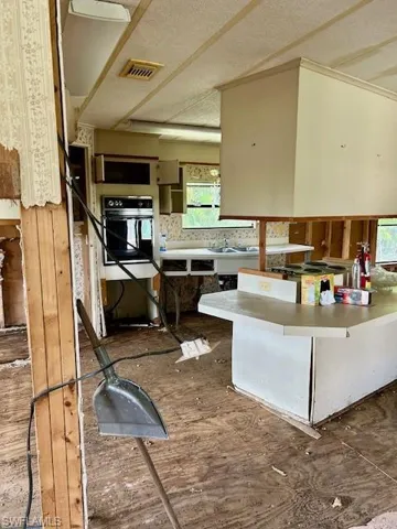 Kitchen featuring plenty of natural light and oven