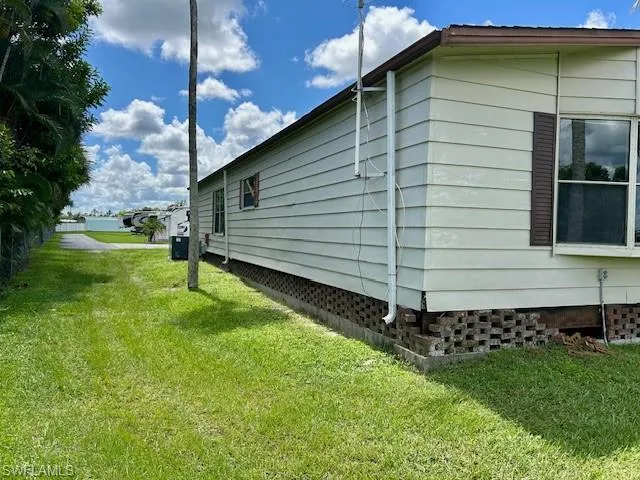 View of home's exterior featuring a lawn