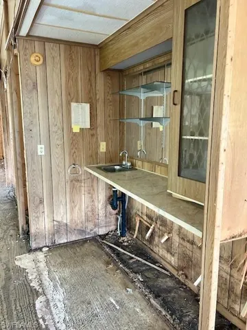 Bar with wood walls and glass insert cabinets