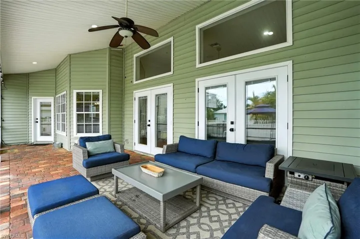 View of patio featuring french doors, outdoor lounge area, and ceiling fan