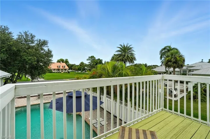 Balcony with view of pool area