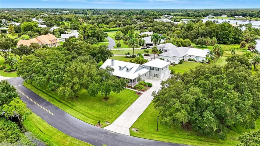 Aerial perspective of suburban area featuring a tree filled landscape