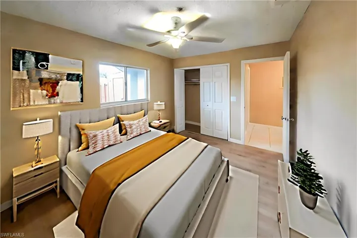 Bedroom with ceiling fan, a closet, and light wood finished floors