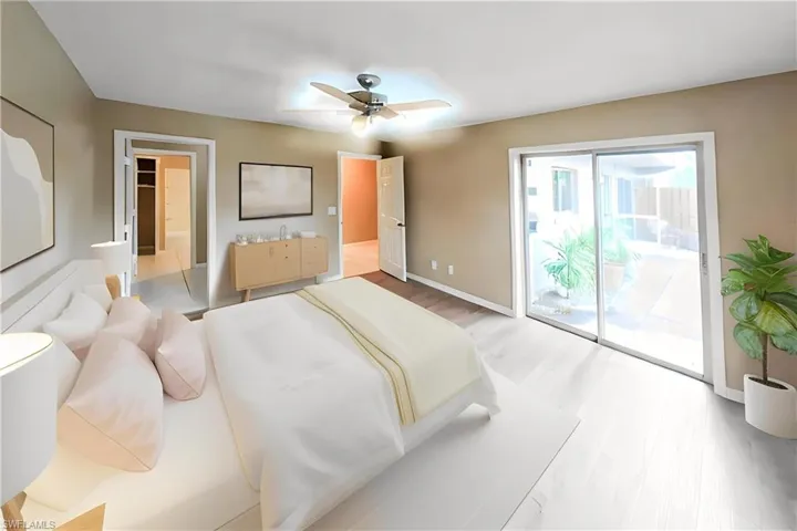 Bedroom with access to exterior, a ceiling fan, and light wood-style floors
