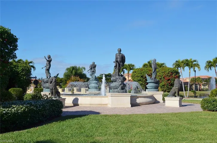 View of property's community with a yard