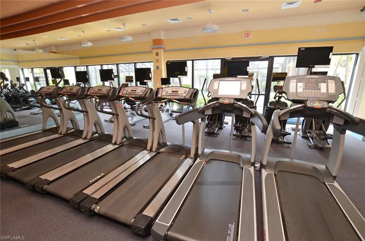 Exercise room featuring a wealth of natural light and crown molding