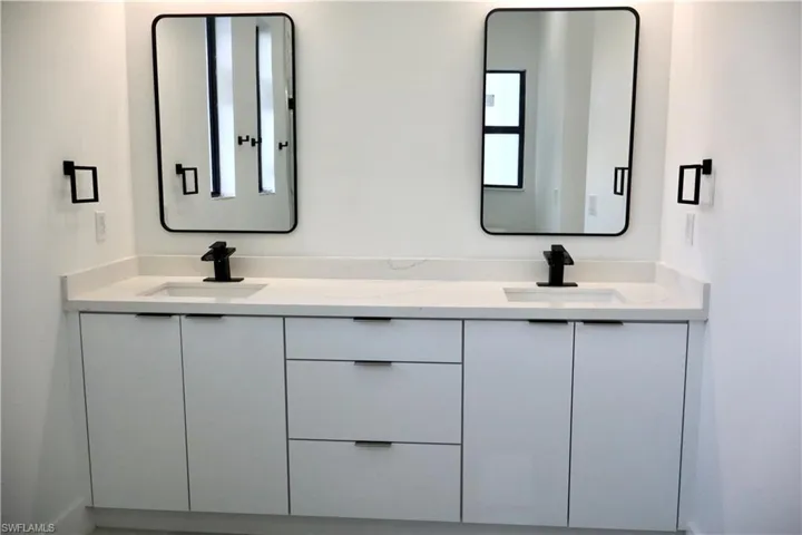 Full bath featuring double vanity