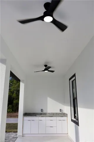 View of patio featuring ceiling fan