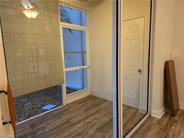 Bathroom with hardwood / wood-style floors