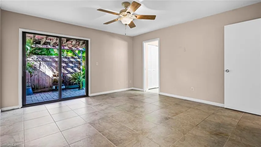 Master bedroom with sliders to patio