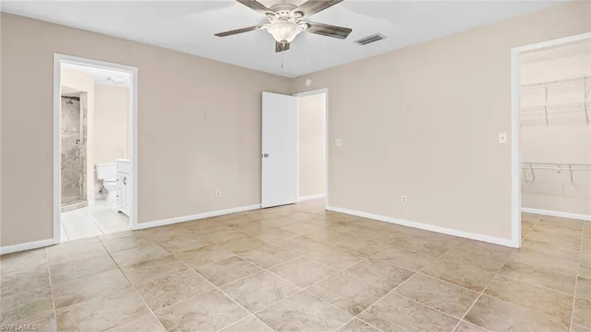 Master bedroom with private bathroom and large walk-in closet