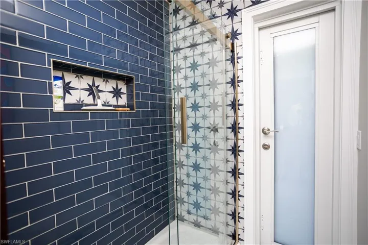 Bathroom featuring a shower stall