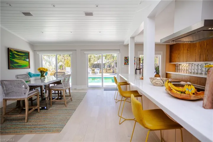 Dining area featuring light wood finished floors and wooden ceiling