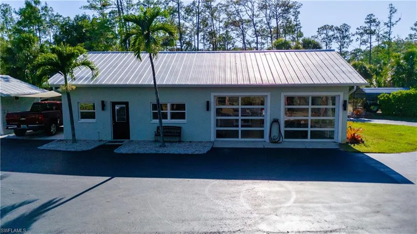Beautiful Detached Garage that has a bathroom, epoxy floors, but is being used as a painting studio