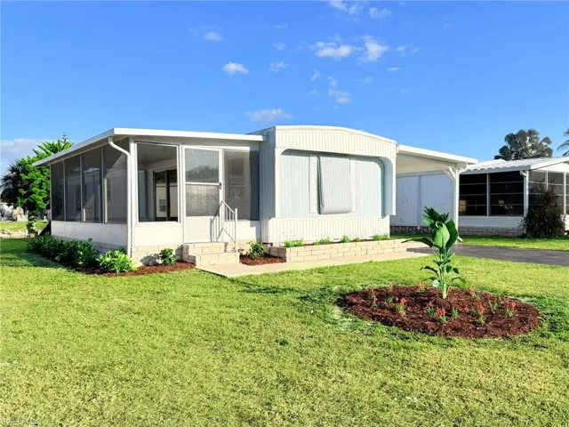 Freshly landscaped with charming curb appeal, this beautifully renovated home offers a welcoming entrance and a peaceful lakefront setting.