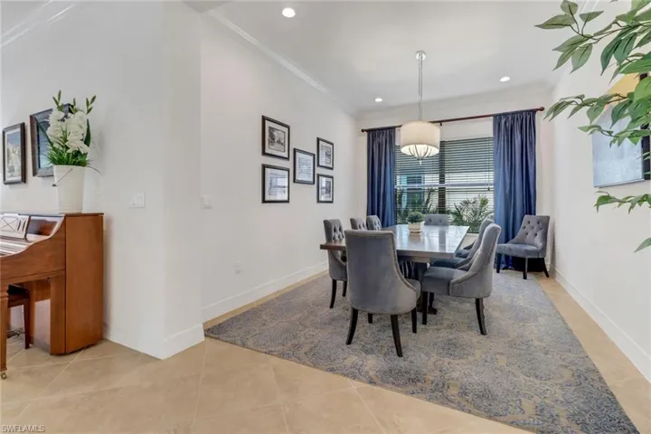 Tiled dining room with crown molding