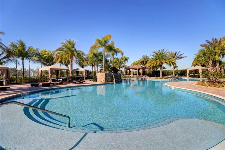 View of swimming pool with a gazebo, a patio area, and pool water feature