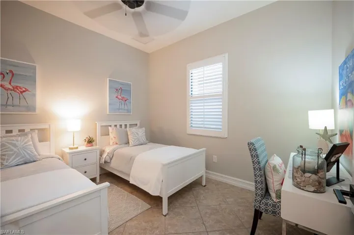 Bedroom featuring a ceiling fan and light tile patterned floors