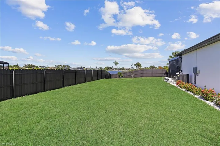View of fenced backyard