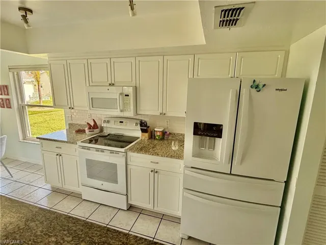 Kitchen with Refrigerator/Freezer, Stove & Microwave