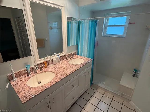 Primary Bathroom with dual sinks and shower