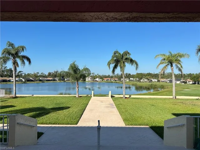 View from clubhouse of grounds, golf course and lake