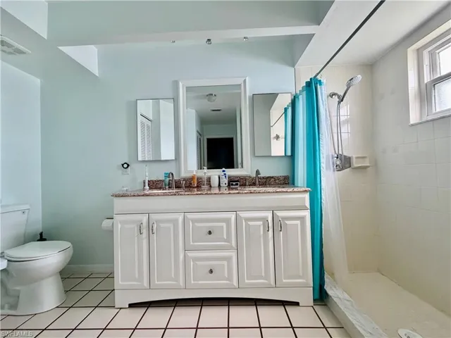 Primary Vanity with dual sinks, shower and toilet