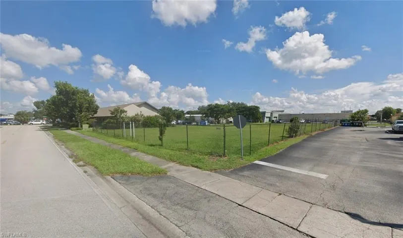 View of asphalt street with sidewalks