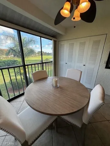 Tiled dining space with a textured wall