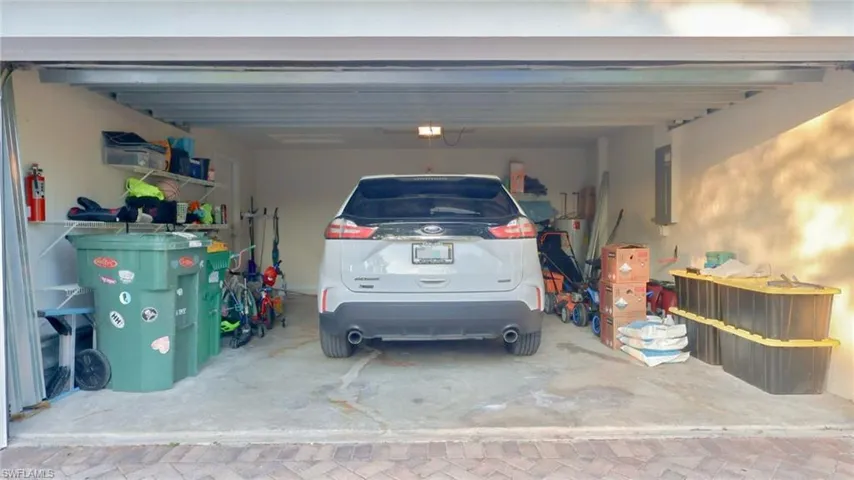 Garage with a garage door opener and electric panel