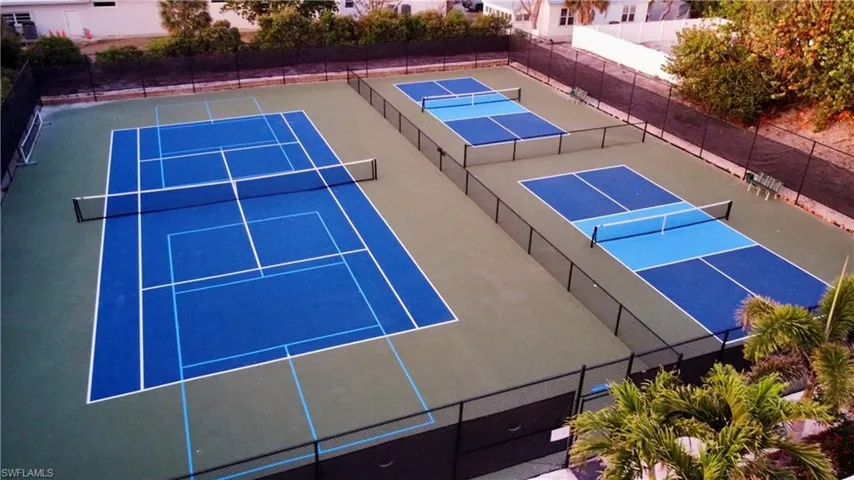 View of sport court featuring community basketball court and fence