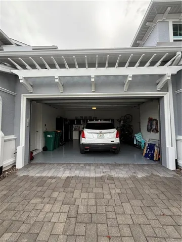 Garage featuring fridge