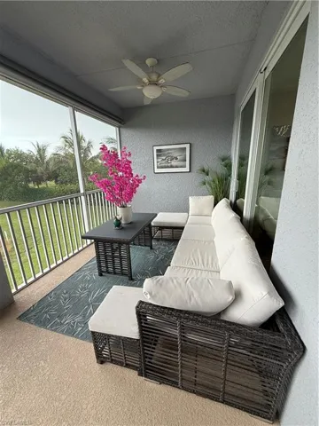 Sunroom / solarium featuring ceiling fan and outdoor lounge area
