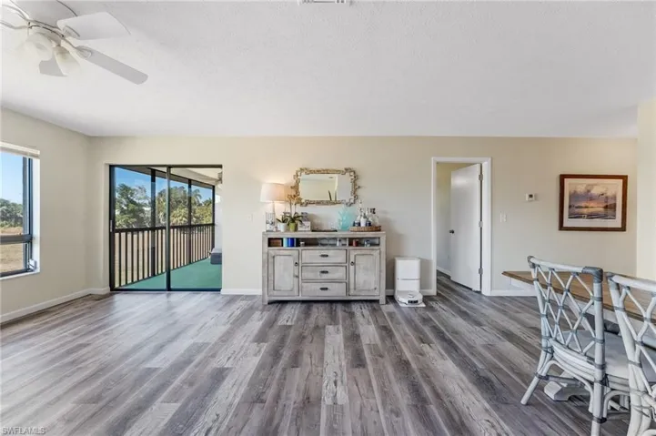 Filled with natural light, the open living space feels airy, comfortable, and inviting.