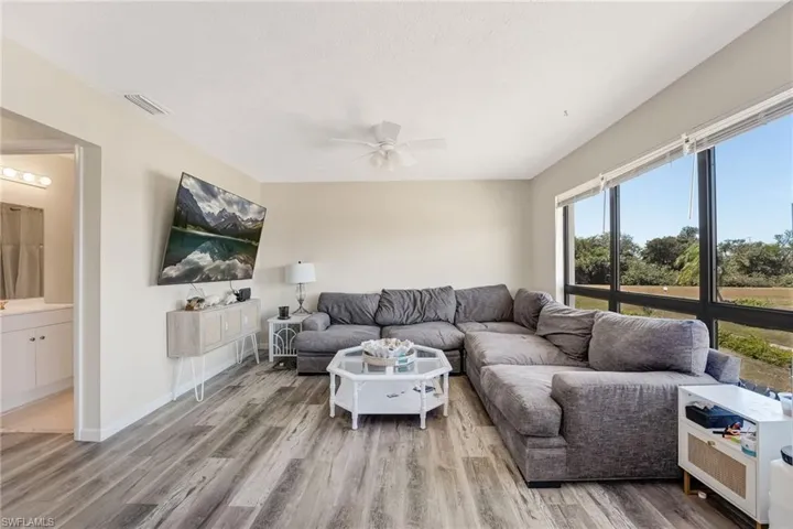 The living area is bright, welcoming, and perfectly positioned to enjoy the waterfront setting.