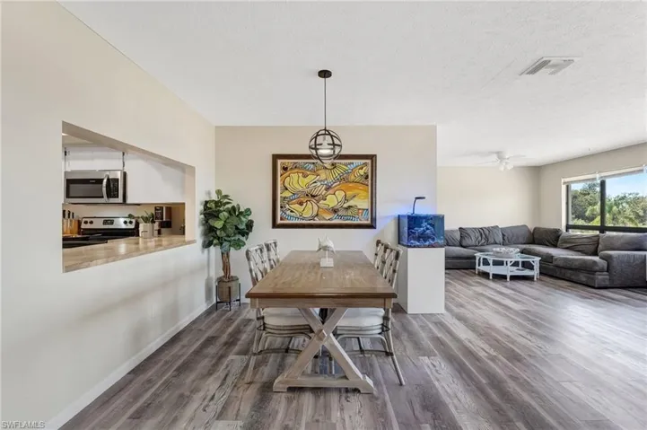 The living area is bright, welcoming, and perfectly positioned to enjoy the waterfront setting.