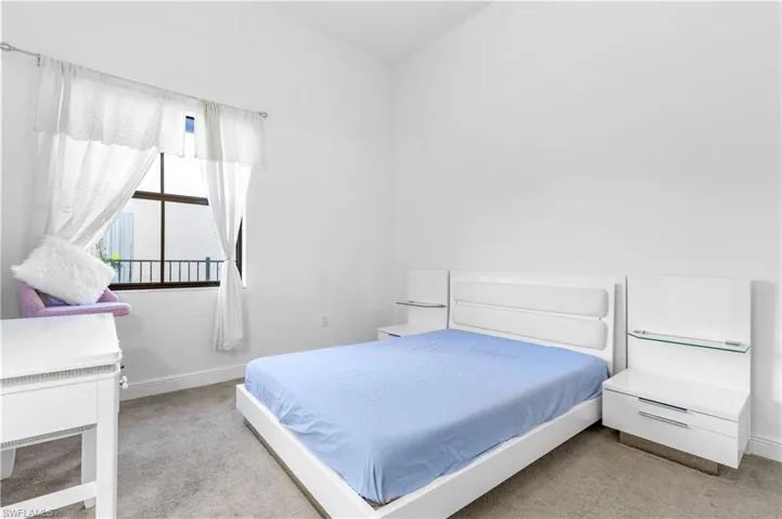 Bedroom with light carpet