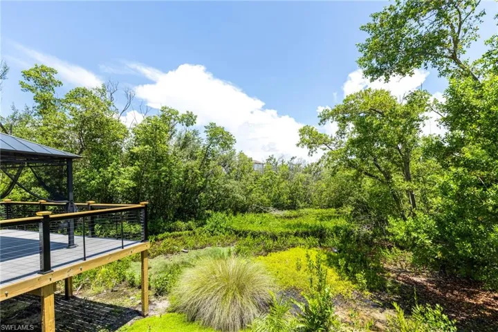 View of yard with a gazebo and a wooden deck